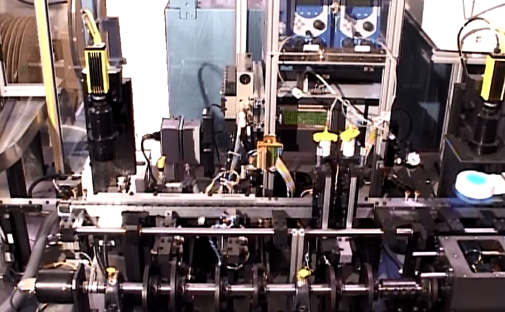 Inside a connector assembly machine with feeders and vision cameras