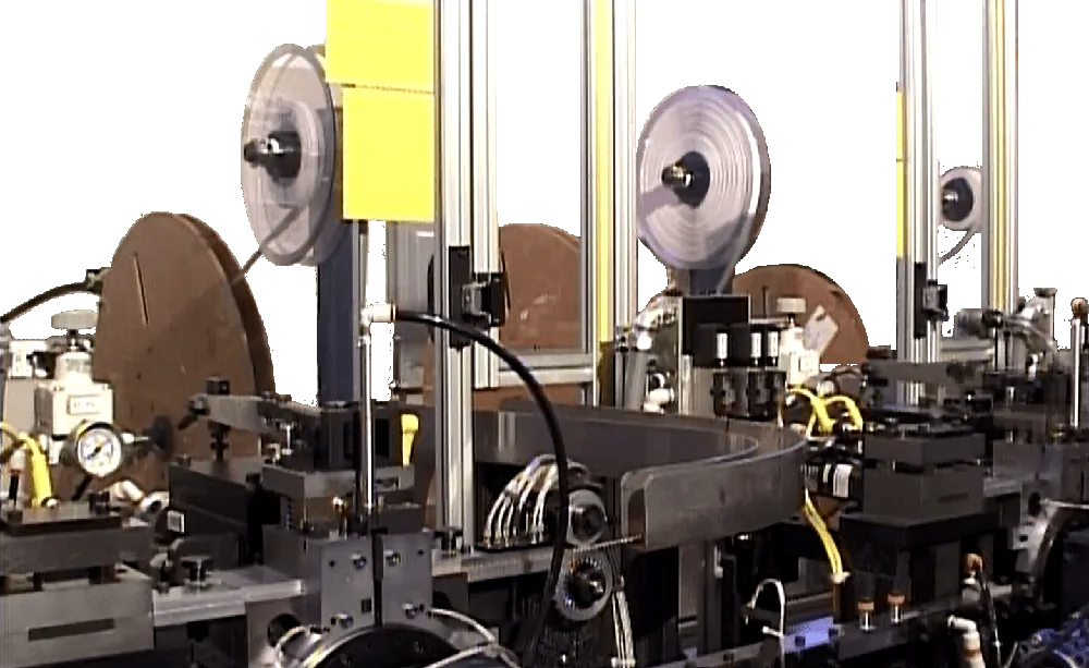 Close-up of the reel feeders and tooling of a connector assembly machine