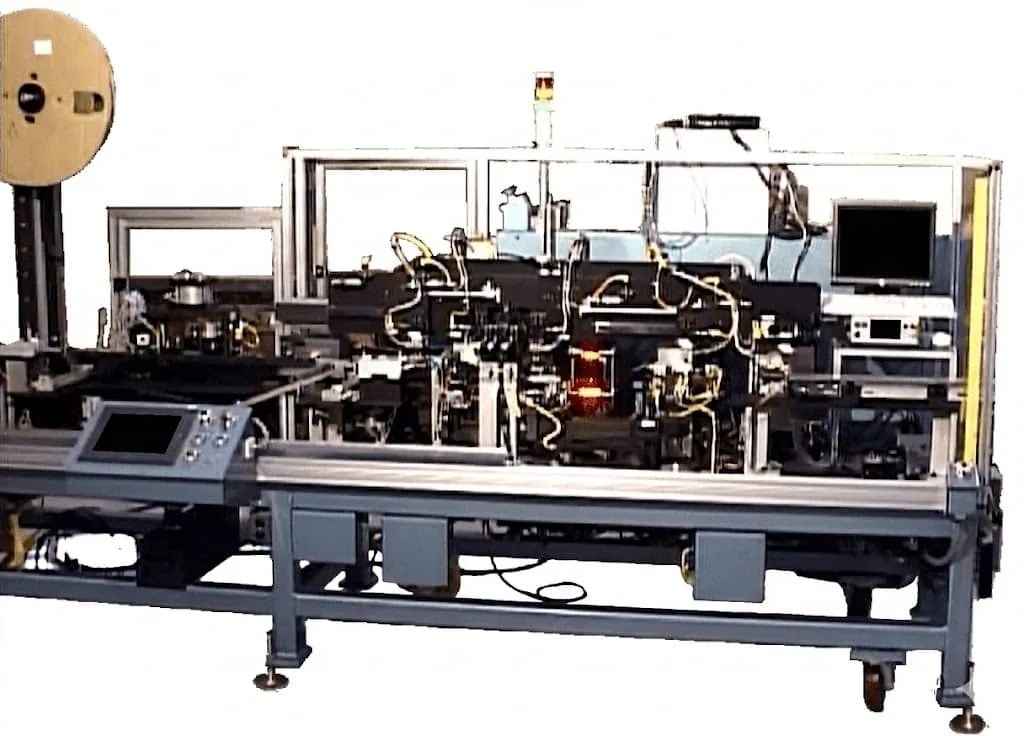 Connector assembly machine on a steel frame with a touchscreen control panel and a reel feeder