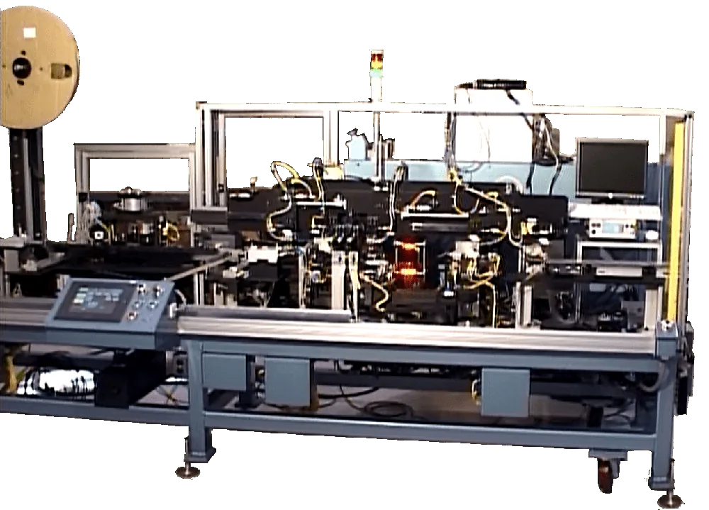 Connector assembly machine on a steel frame with a touchscreen control panel and a reel feeder