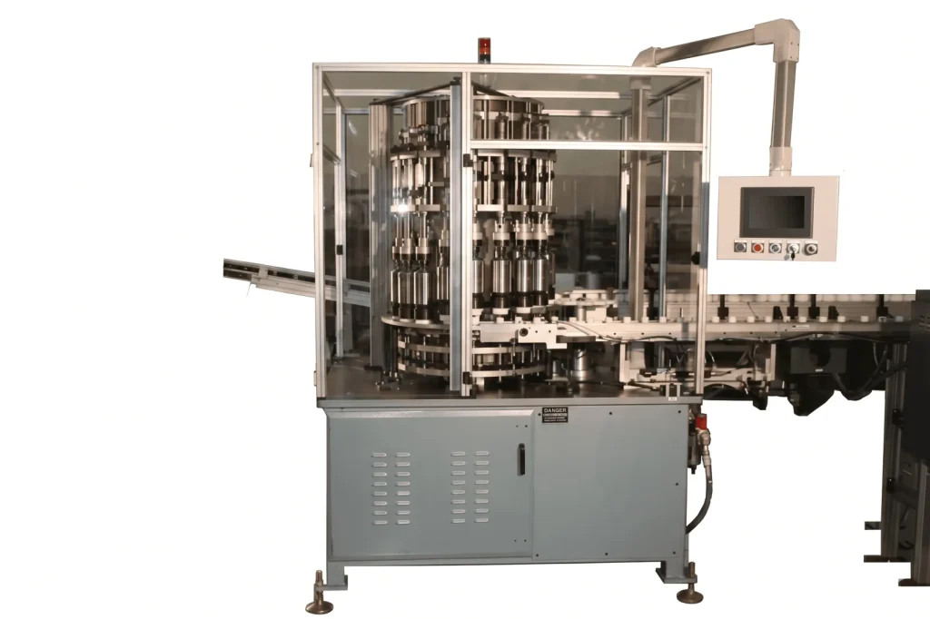 Continuous motion machine with an overhead monitor and an output conveyor