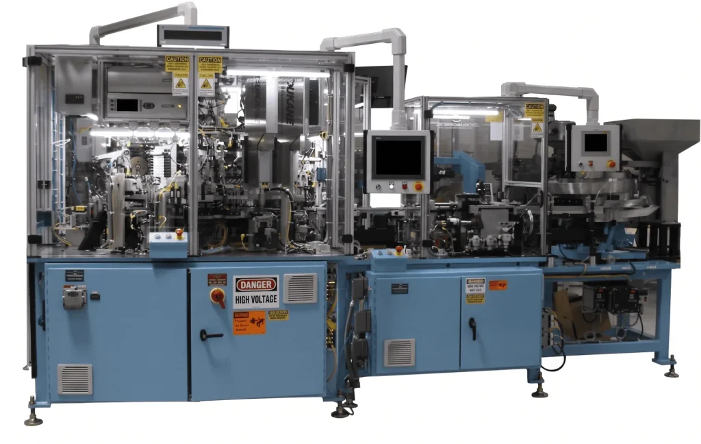 Blue indexing dial assembly machine with a control panel and a danger label, shown on white