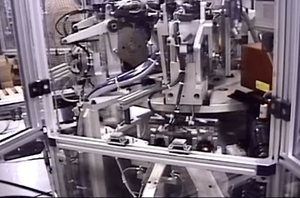 Close-up of the aluminum frame and tooling of an indexing machine