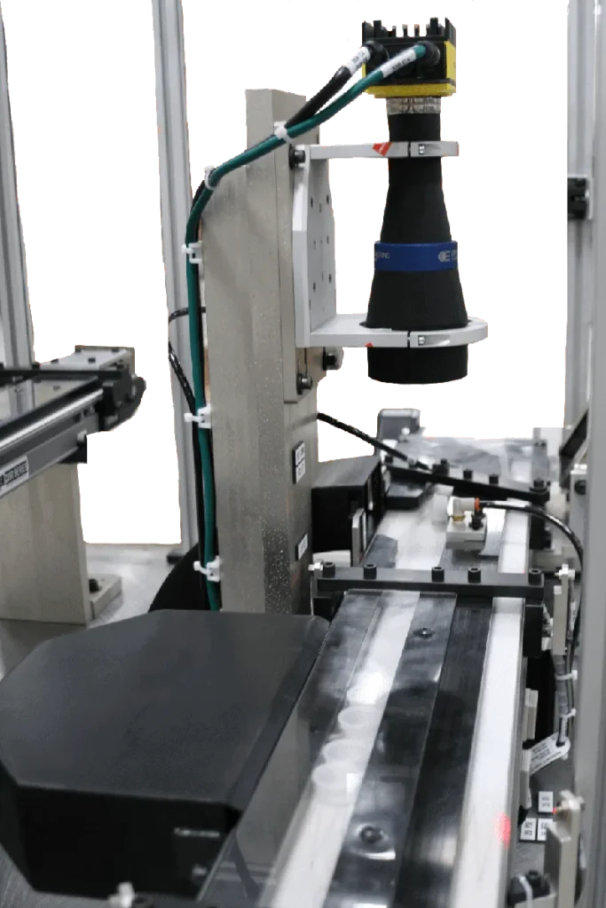 Camera mounted over a conveyor on an inspection machine