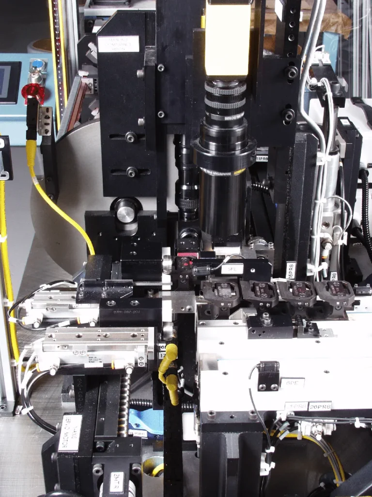 Close-up of the vision camera and tooling on an inspection machine