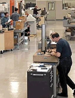 Technician working at a tool cabinet on the shop floor