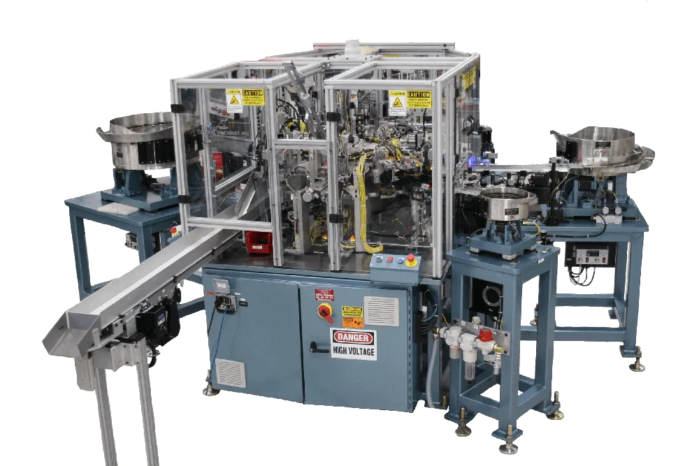 Two blue indexing dial assembly machines with bowl feeders and a conveyor